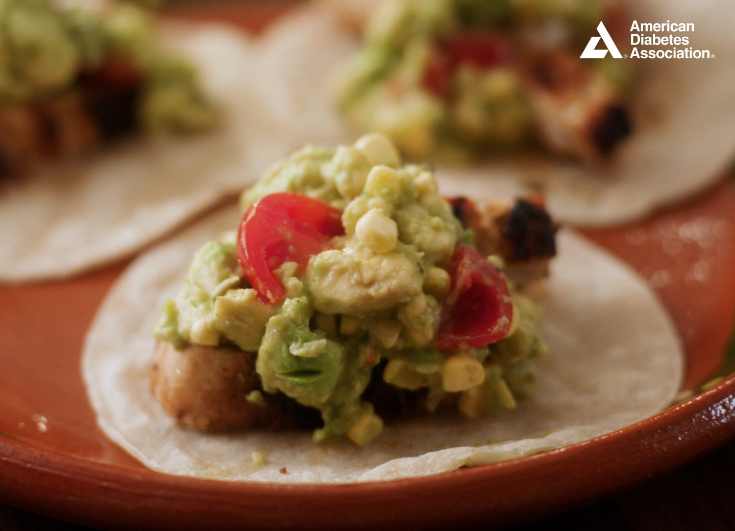 Lime – Rubbed Chicken Tacos with Corn Guacamole